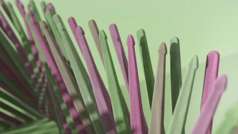3d rendering showcasing multiple drumsticks in pink and green, forming a unique Illustrazione stock