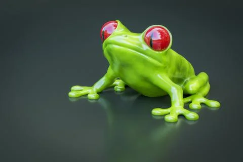 3D rendering of a slimy green treefrog with red eyes on gray background Stock Illustration