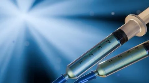 A 3d rendering of syringe bathed in radiant light Stock Illustration