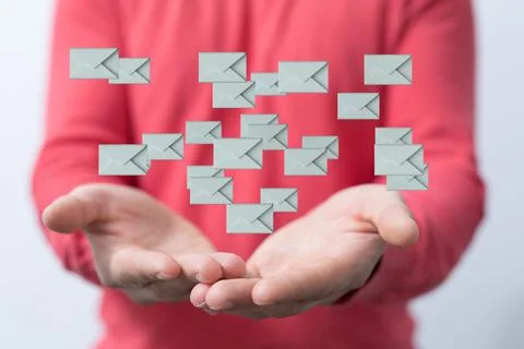 A 3D rendering of technological envelopes over a male's hand- Message, online Stock Photos