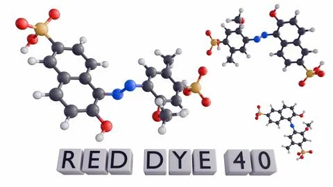A 3D rendering of text "RED DYE 40" on a row of red blocks. Stock Illustration
