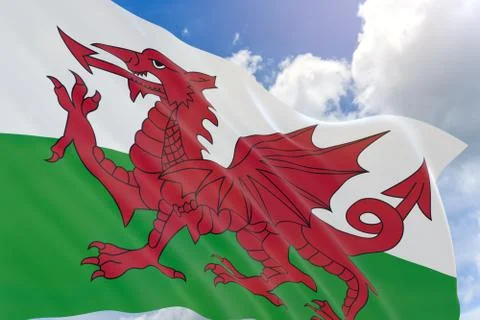 3D rendering of Wales flag waving on blue sky background Stock Photos