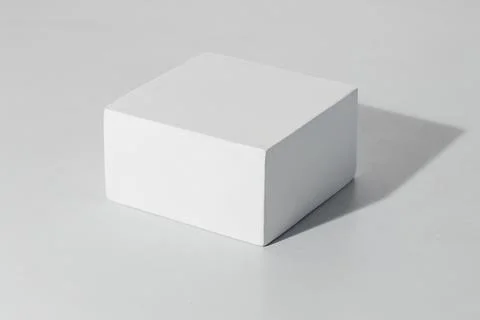3D rendering of a white empty cube with mockup against a white background Stock Illustration