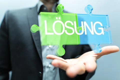 3d rendering of the word SOLUTION in German on a businessman's palm Stock Photos