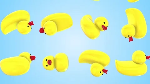 3D Rubber Ducks Falling on a Light Blue Background. Toy Ducks. 4K Stock Footage 284443405