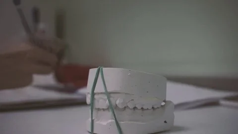3D Scanning a model of human teeth from gypsum close-up. Creation 3D model for Stock Footage 128245699