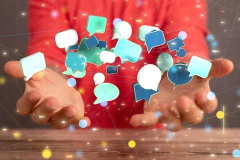 3d speech bubble icons hovering above the hands. Stock Photos