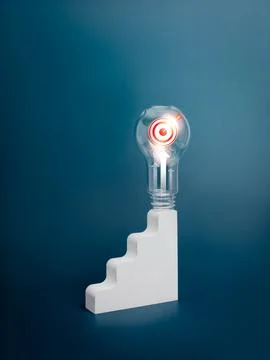 3d Target icon inside lightbulb stand on top of white staircase as bar grap.. Stock Photos