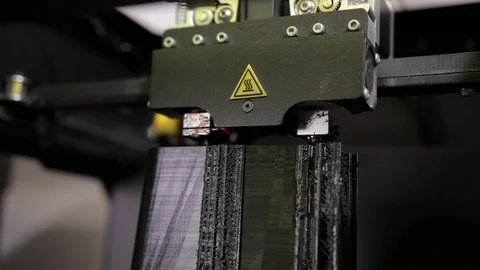 3D technology close up of the printer head printing a plastic part product. Stock Footage 124891693