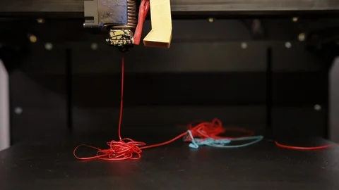 3D technology the printer prints part from plastic cable thread close up. Stock Footage 125129894