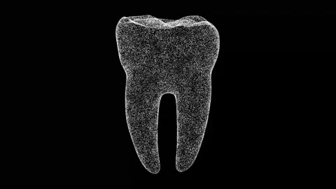 3D tooth rotates on black bg Stock Footage 243520936