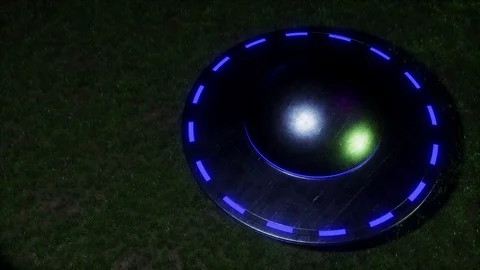 3D visualization of a flying saucer standing on the grass Stock Footage 130094391