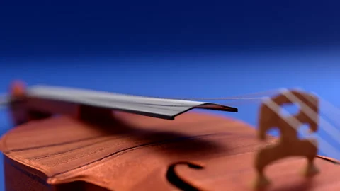 3d visualization of a violin on a blue table Stock Footage 158604014