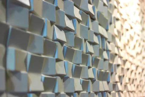 3d white mosaic surface wall on warm light Stock Photos