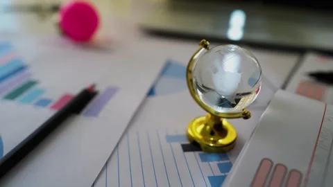 3d world globe on business papers background Stock Footage 293517037