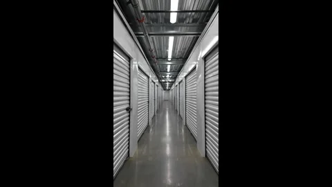 3K vertical walking footage inside modern self storage facility in the  USA  스톡 동영상 333571652