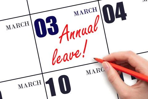 3rd day of March. Hand writing the text ANNUAL LEAVE and drawing the sun on t Stock Photos