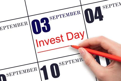 3rd day of September. Hand drawing red line and writing the text Invest Day o Stock Photos