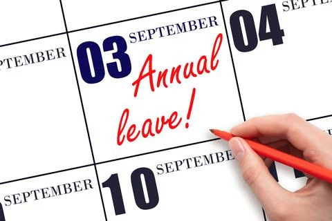 3rd day of September. Hand writing the text ANNUAL LEAVE and drawing the sun  Stock Photos