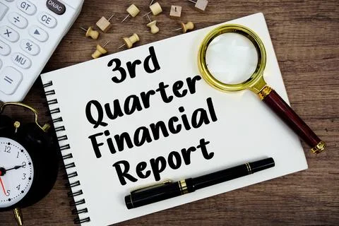 3rd Quarter Financial Report text written on notepad with pen, alarm clock,.. Stock Photos