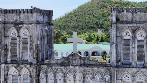 3x aerial orbit around the cross of Mang Lang Church Stock Footage 341855937