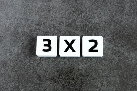 3x2 number on dark background Foto stock
