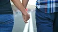 4 in 1 video! Couple (pair) walk and hold hands at the road in the city center 4k or 4k+ Resolution