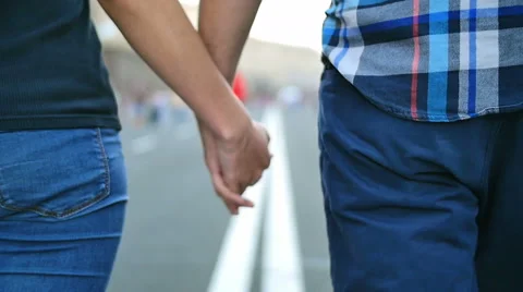 4 in 1 video! Couple (pair) walk and hold hands at the road in the city center Vídeos de archivo 54631632