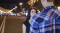 4 in 1 video! Lovers couple (pair) stand at city street at night, look and smile 4k or 4k+ Resolution