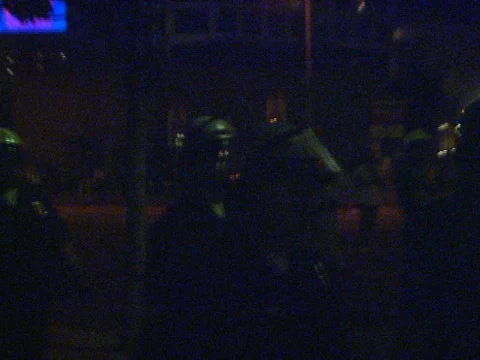 4-29-1992 LA Riots Police Moving to Secure Corner Stock Footage 78235764