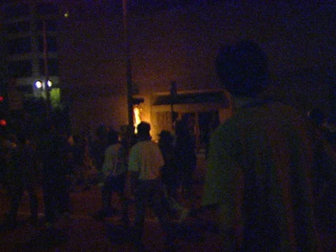 4-29-1992 LA Riots Small Fire as Protesters walk around 2 Stock Footage 78237132