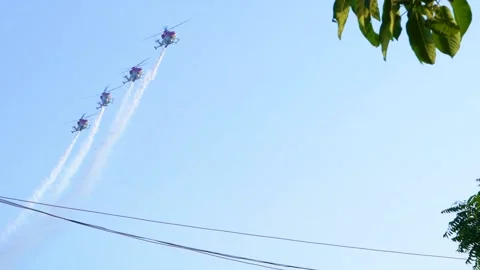 4 Army Helicopters together performing Air Show in the Sky - 100fps Stock Footage 220170177