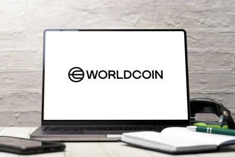  4 August 2023: Laptop computer with the Worldcoin logo on the screen. Wor... Stock-Fotos
