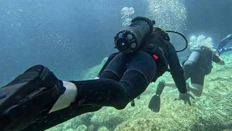 4 August 2025 Scuba diving bubbles at surface pan to divers  Malta, Comino Stock Footage 314744809