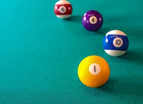 4 ball from a pool or billiard on a billiard table with a number 1 ball in .. Stock Photos