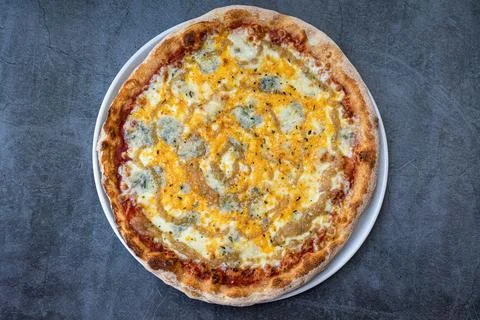 4 cheese pizza on a rustic background. top view Stock Photos
