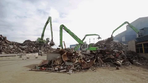 4 Clamshells sorting the scrap metal, general shot Stock Footage 71591073