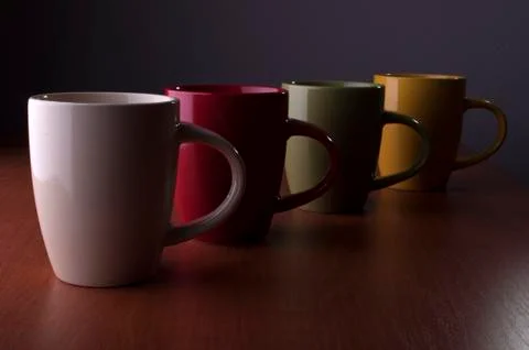4 colored cups Stock Photos