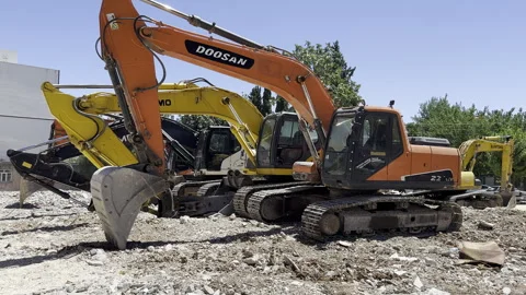 4 construction equipment excavators side by side. Stock Footage 246130898
