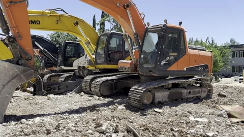4 construction equipment excavators side by side. Demolition machine. Stock Footage 246132049