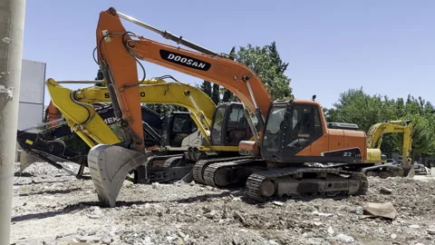 4 construction equipment excavators side by side. Demolition machine. Stock Footage 246224248
