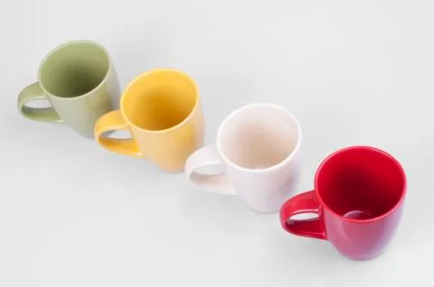 4 cups on white background Stock Photos