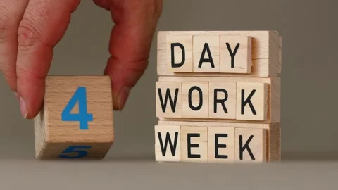 4 day work week symbol. Concept words. Businessman turns the cube and chang.. Stock Footage 282614146