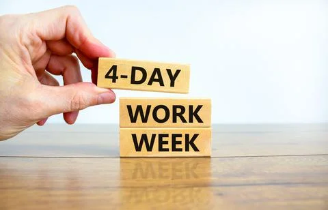 4-day work week symbol. Concept words 4-day work week on wooden blocks on bea Stock Photos