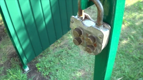 4-digit keyless door padlock. The iron doors are open. Stock Footage 194264594