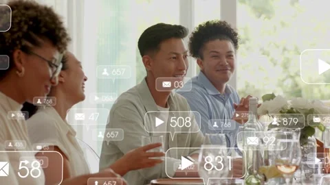 4 diners clapping, offscreen host cueing floating social icons over group Stock Footage 333064651