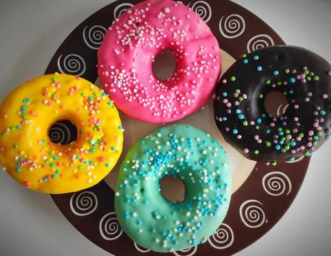 4 donuts - 4 colours Stock Photos