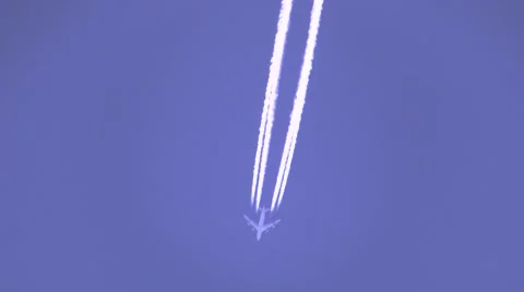 4-engine jet fly over with contrails zoomed handheld V05047 Video stock 47829558
