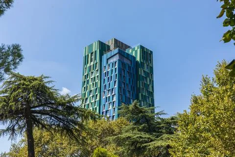 4 Ever Green Tower Skyscraper Emerging Above Trees in Tirana Stock Photos