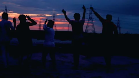4 friend ,Young men walking on sunset,Silhouettes of  friends runs at sunset,fri Stock Footage 140041949